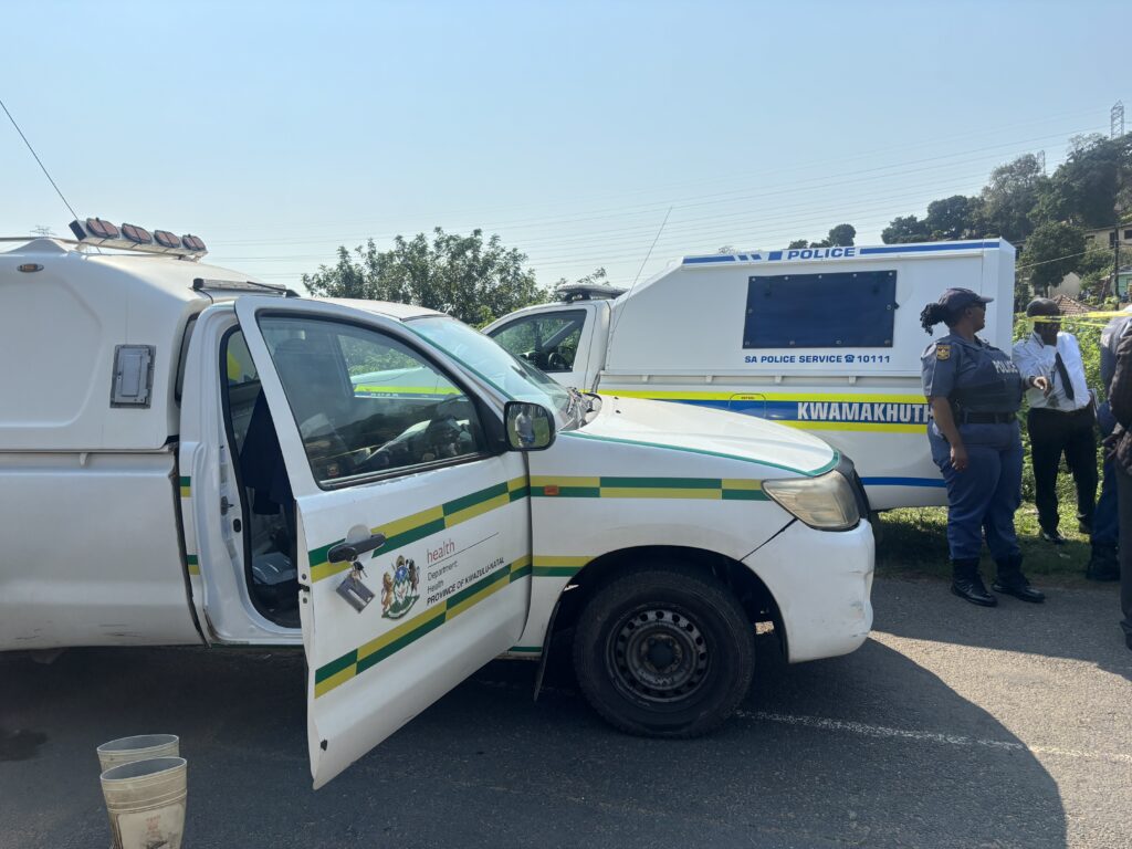Police vehicles on the scene of KwaMakhutha mass shootings.