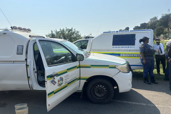 Police vehicles on the scene of KwaMakhutha mass shootings.