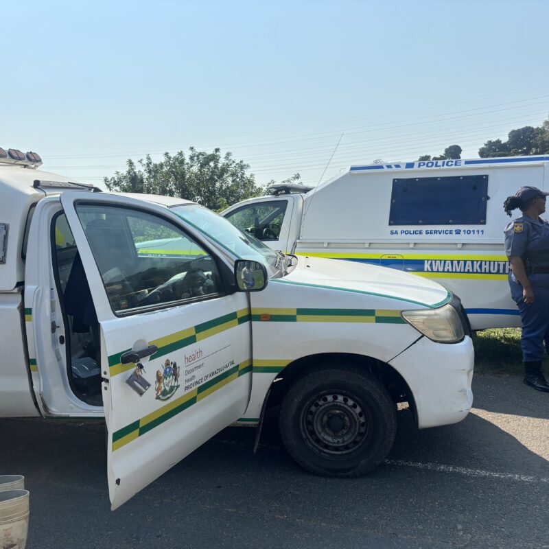 Police vehicles on the scene of KwaMakhutha mass shootings.