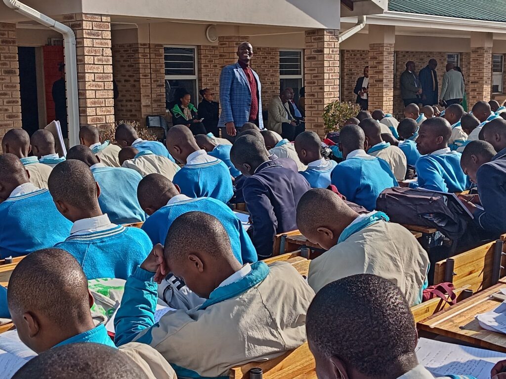 Educator addressing pupils in school yard-Image by Department of Basic Education