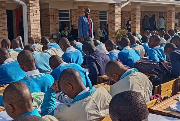 Educator addressing pupils in school yard-Image by Department of Basic Education