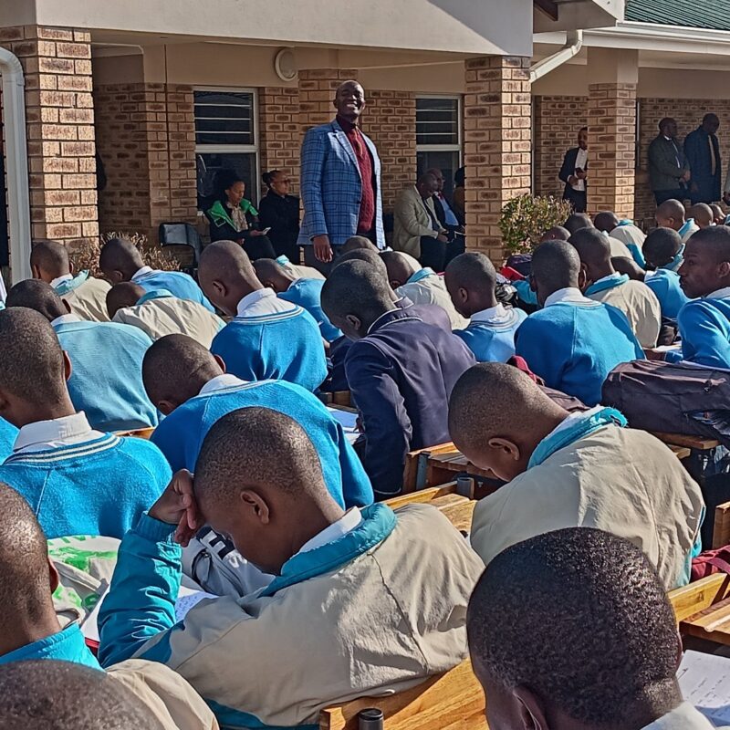 Educator addressing pupils in school yard-Image by Department of Basic Education